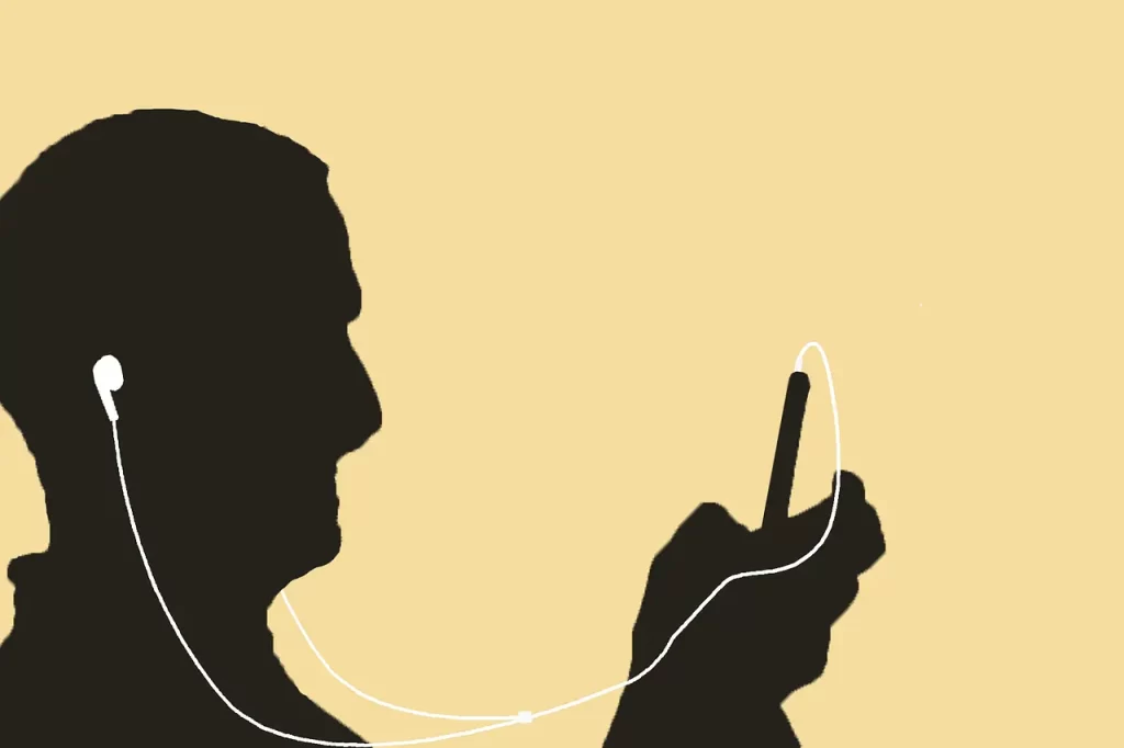 Man listening with ear buds